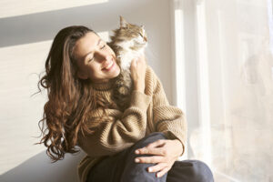 pets-are-good-for-your-health-woman-and-cat-in-sunshine.jpg